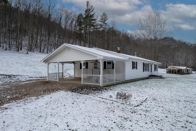 view of front of house with ceiling fan and covered porch