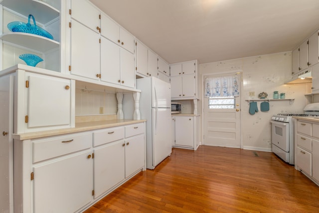 kitchen featuring white cabinetry, white appliances, and light hardwood / wood-style flooring