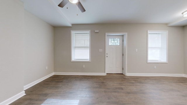 entryway with ceiling fan and dark wood-type flooring