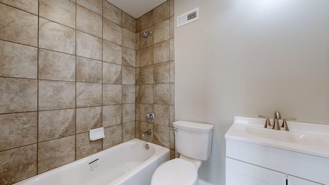 full bathroom featuring vanity, toilet, and tiled shower / bath combo