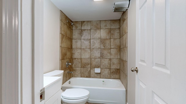 full bathroom featuring vanity, toilet, and tiled shower / bath