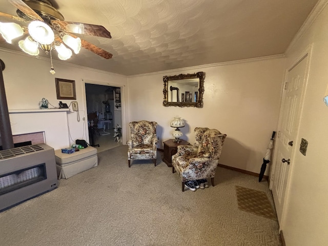 carpeted living room with heating unit, crown molding, and ceiling fan