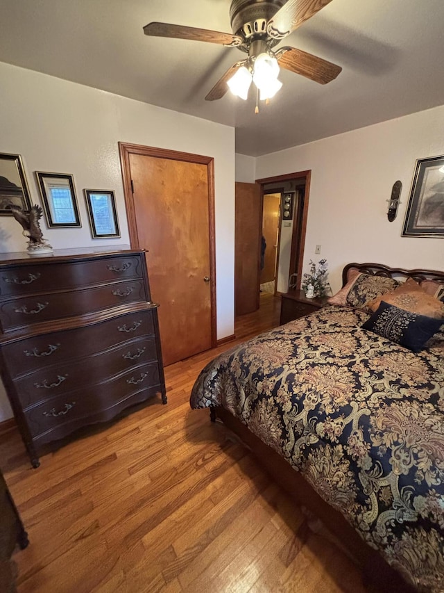 bedroom featuring ceiling fan and light hardwood / wood-style flooring