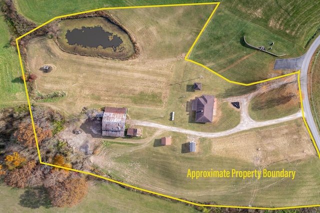 birds eye view of property with a rural view