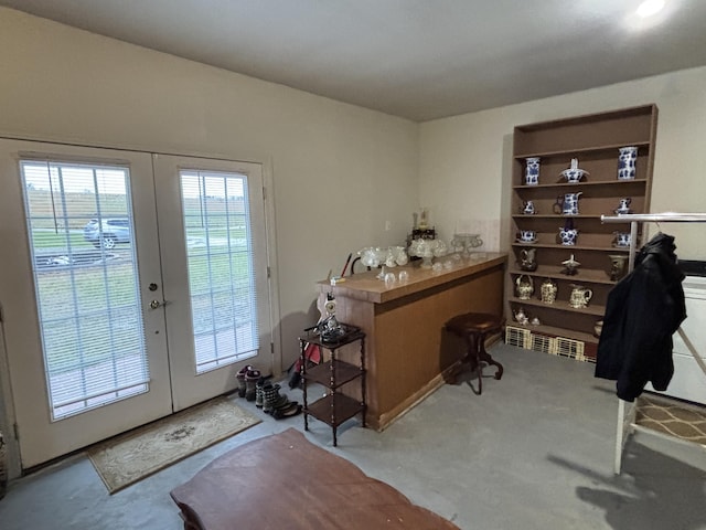 interior space featuring french doors and light colored carpet