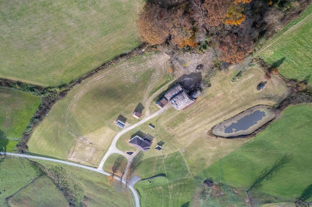 drone / aerial view featuring a water view and a rural view