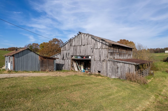 view of outbuilding featuring a yard