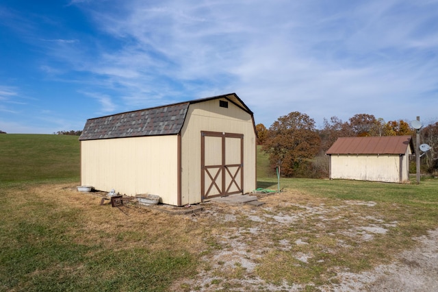 view of outbuilding with a lawn