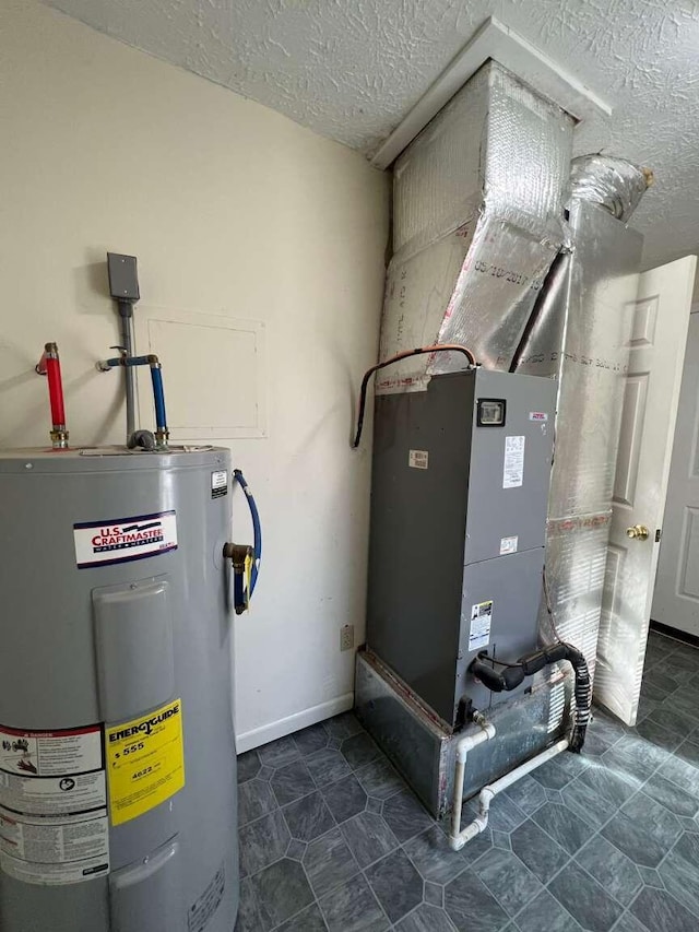 utility room featuring water heater