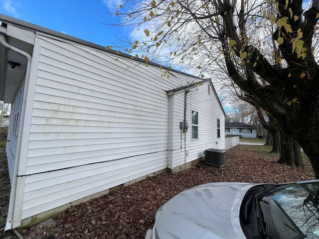 view of side of home featuring central AC