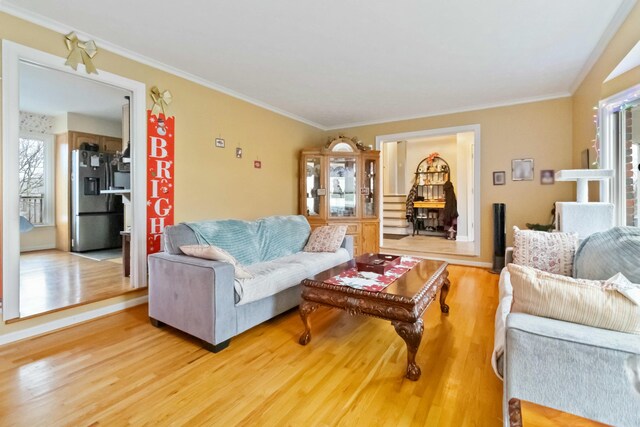 tiled entryway with a textured ceiling and ornamental molding