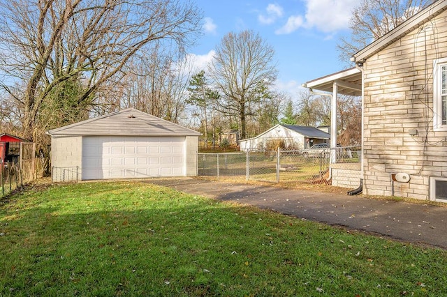 view of yard featuring an outbuilding and a garage