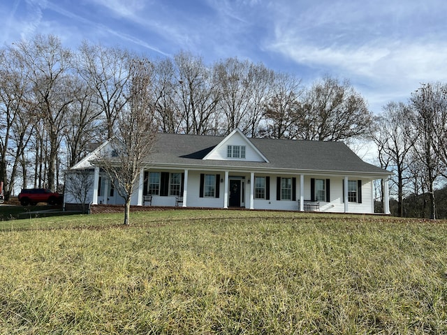 view of front facade with a front lawn and covered porch