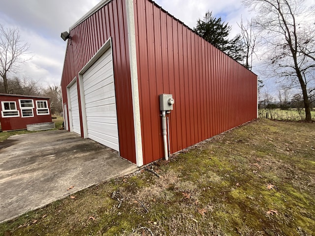 view of outbuilding featuring a garage