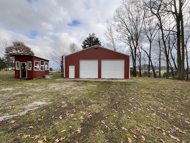 garage with a lawn