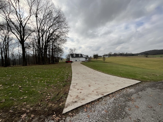 view of property's community with a lawn