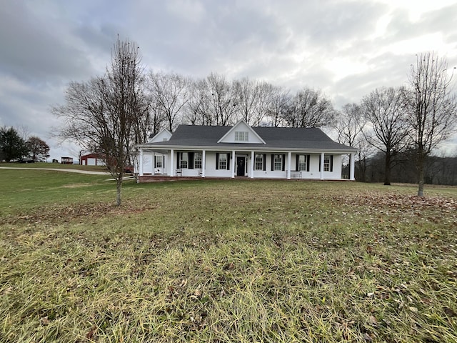 farmhouse-style home featuring a porch and a front lawn