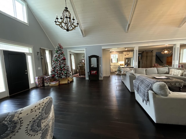 living room with beam ceiling, wooden ceiling, dark wood-type flooring, an inviting chandelier, and high vaulted ceiling