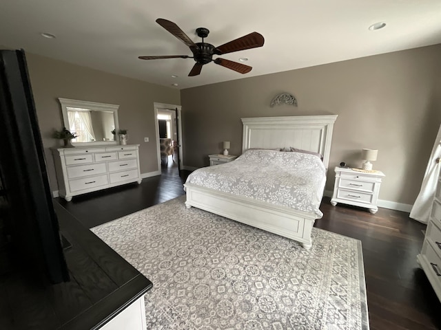 bedroom with ceiling fan and dark hardwood / wood-style flooring