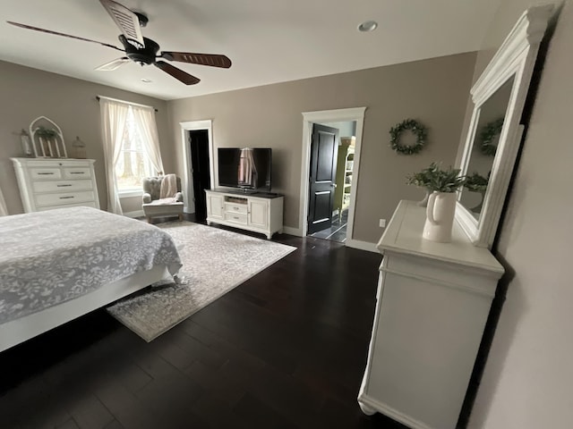 bedroom featuring ceiling fan and dark wood-type flooring