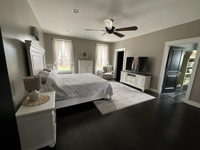 bedroom with ceiling fan and dark hardwood / wood-style floors