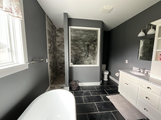 bathroom featuring tile patterned flooring, vanity, separate shower and tub, and a healthy amount of sunlight