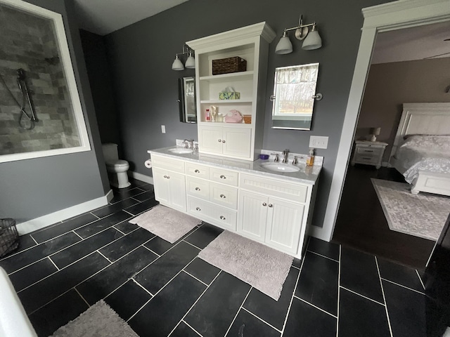 bathroom with tile patterned floors and vanity