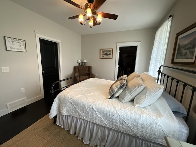 bedroom featuring ceiling fan, wood-type flooring, and a closet