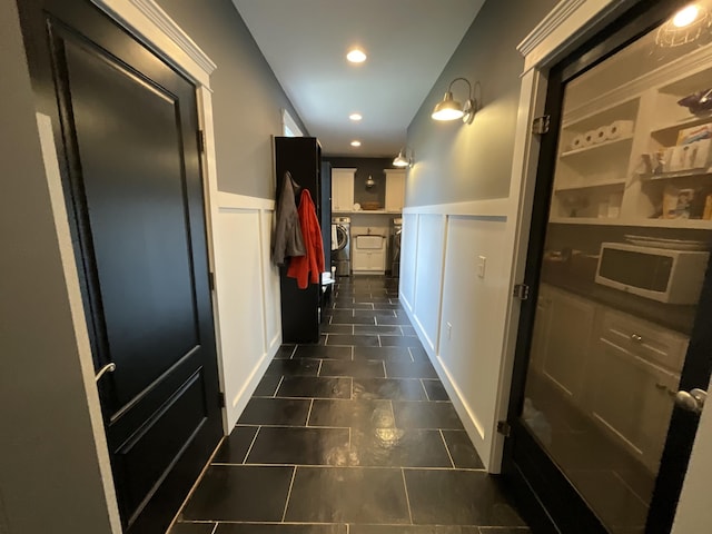 hallway with washer and clothes dryer