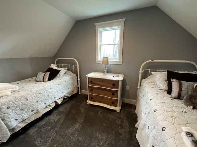 carpeted bedroom with lofted ceiling