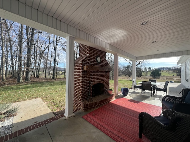 view of patio / terrace with an outdoor brick fireplace