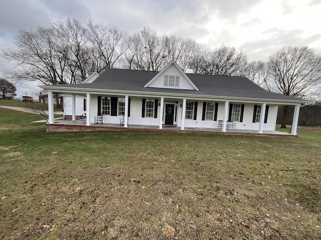 country-style home with a porch and a front yard