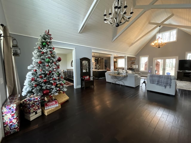 living room with dark wood-type flooring, high vaulted ceiling, a chandelier, and beamed ceiling