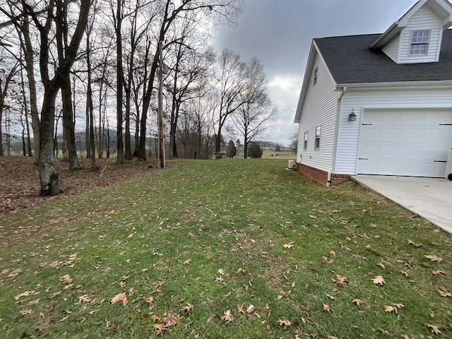 view of yard featuring a garage