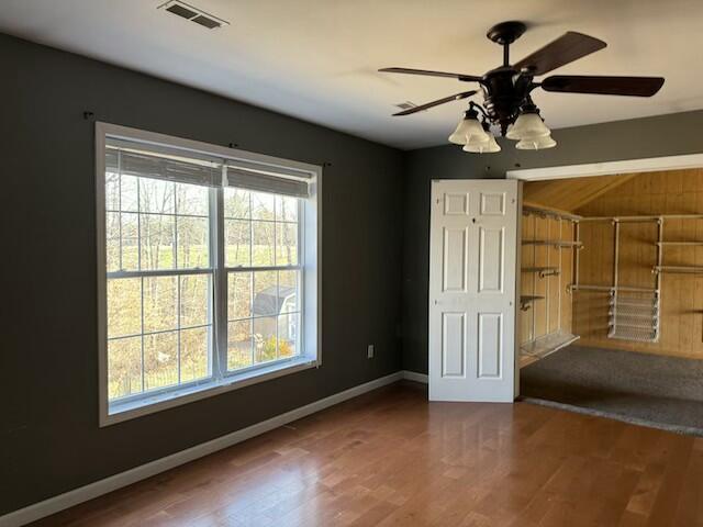 unfurnished bedroom featuring ceiling fan and hardwood / wood-style floors