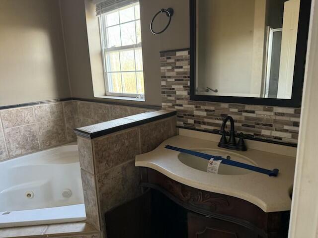 bathroom with a bath and sink