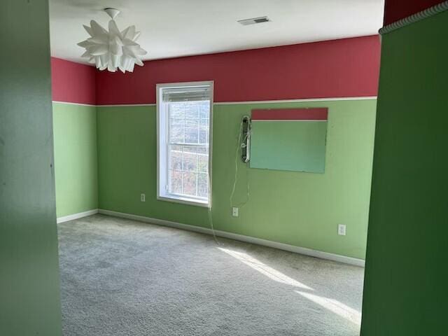 unfurnished room featuring carpet