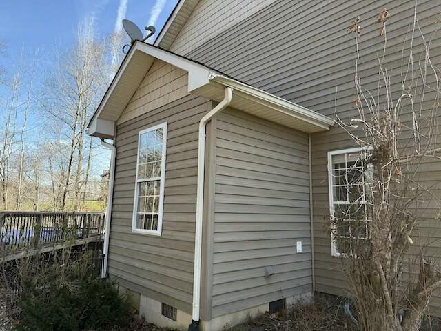 view of home's exterior with a deck