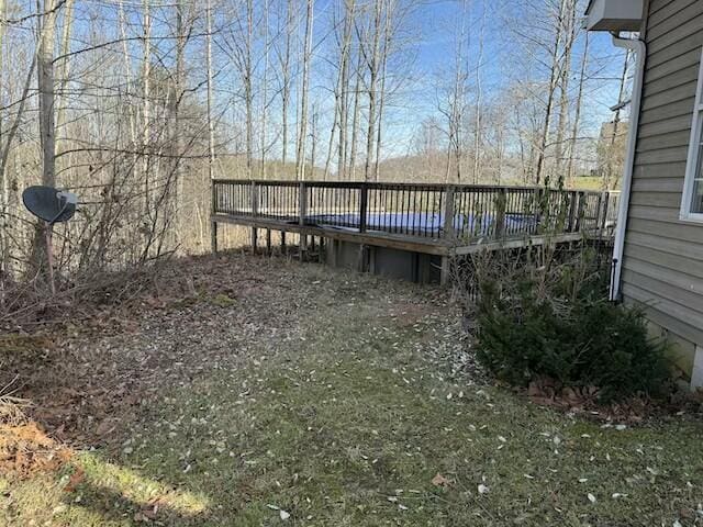 view of yard with a wooden deck