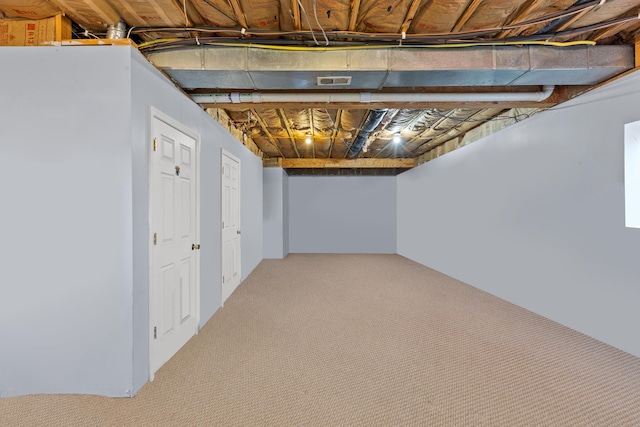 basement featuring carpet flooring