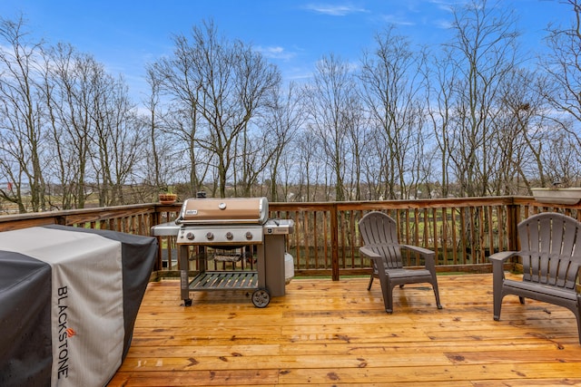 wooden deck with area for grilling