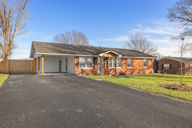 single story home with a carport and a front yard