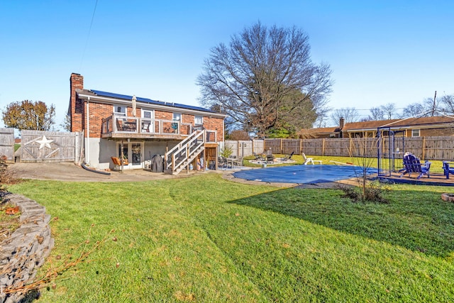 view of yard with a patio and a pool side deck