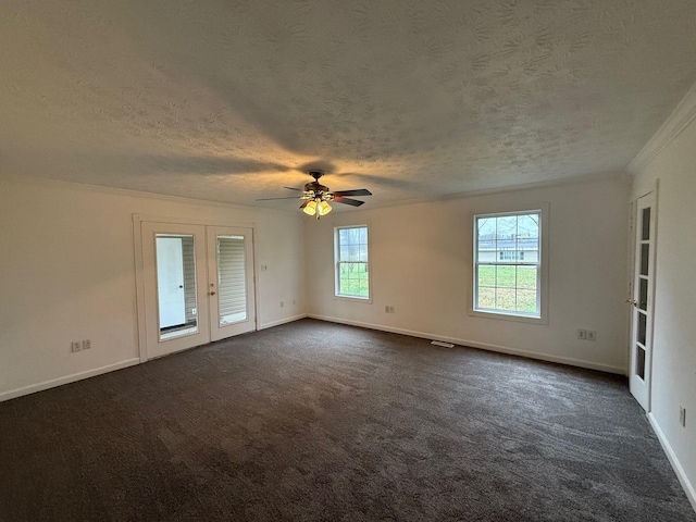 carpeted empty room with ceiling fan, ornamental molding, a textured ceiling, and french doors