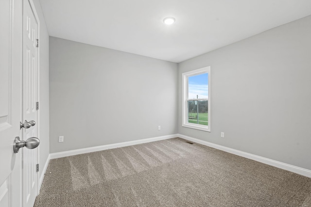 unfurnished room featuring carpet flooring