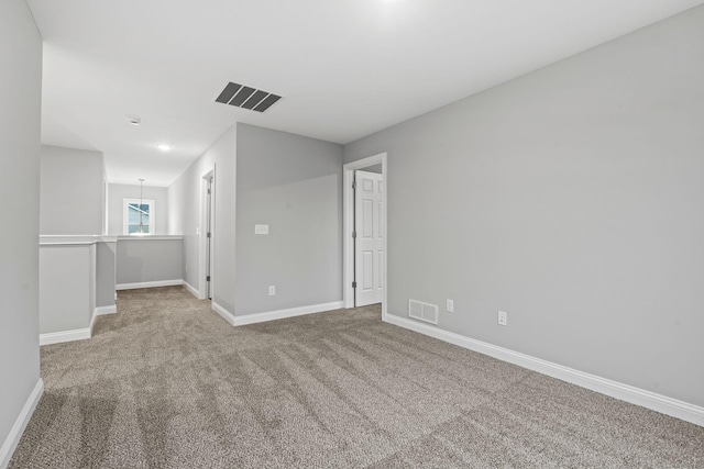 empty room with light colored carpet