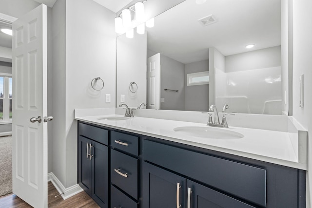 bathroom with hardwood / wood-style floors and vanity