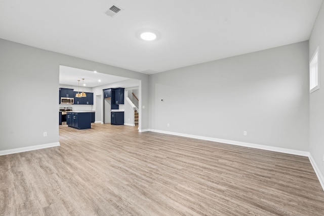 unfurnished living room with wood-type flooring