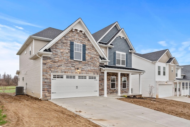 view of front of house featuring central AC unit and a garage