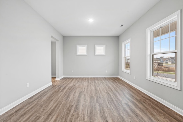 spare room featuring hardwood / wood-style floors